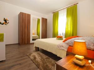 Postel nebo postele na pokoji v ubytování Apartment Luciano 1540