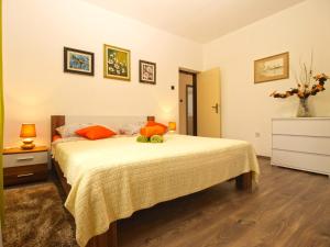 Postel nebo postele na pokoji v ubytování Apartment Luciano 1540