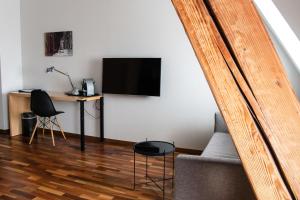 Un televizor și/sau centru de divertisment la Royal Hotel - Urban Living