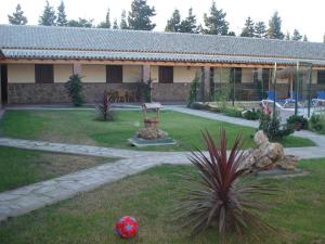 a house with a soccer ball in the yard at Residencial La Teja in Zahora