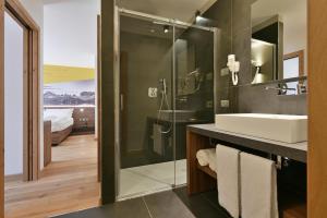 Kúpeľňa v ubytovaní Dolomeet Boutique Hotel