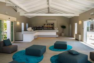 a living room with two chairs and a table at VOI Marsa Siclà Essentia in Sampieri