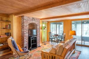 a living room with a couch and a fireplace at 406 E ARCTIC in Folly Beach