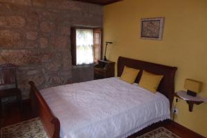 מיטה או מיטות בחדר ב-Casa do Rio