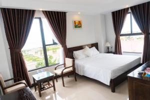 Postel nebo postele na pokoji v ubytování Aries Hotel