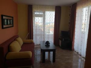 a living room with a couch and a table at Свети Кирил Лозенец in Lozenets