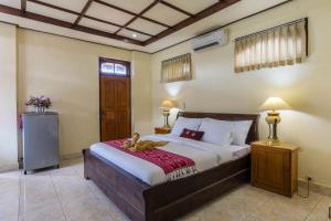 Un pat sau paturi într-o cameră la Sagitarius Inn