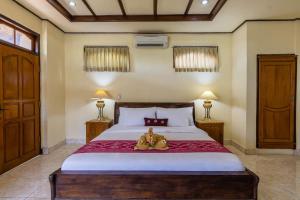Un pat sau paturi într-o cameră la Sagitarius Inn
