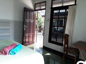 Postel nebo postele na pokoji v ubytování Manuh Guest House