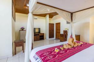 Un pat sau paturi într-o cameră la Sagitarius Inn