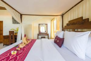 Un pat sau paturi într-o cameră la Sagitarius Inn