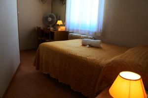 Letto o letti in una camera di Hotel Loreto