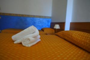 Letto o letti in una camera di Hotel Loreto