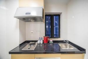 Kitchen o kitchenette sa Xing Yu Legend Service Apartment Canton Fair Branch