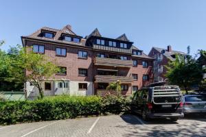 a van parked in front of a large building at Hotel Elbinsel free parking in Hamburg