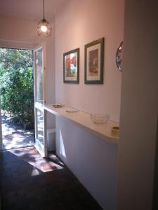 a kitchen with a white counter and a window at Casa Vacanze Località Le Dune in Castiglione della Pescaia