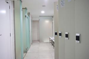 a hallway of a hospital with green and white walls at Hotel Torre del Mar - Ibiza in Playa d'en Bossa