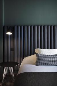 Ένα ή περισσότερα κρεβάτια σε δωμάτιο στο Hôtel Diana Dauphine