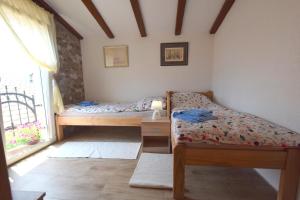 Postel nebo postele na pokoji v ubytování Apartments Neven