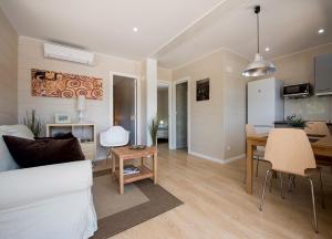 a living room with a couch and a dining room at Camping Villasol in Benidorm