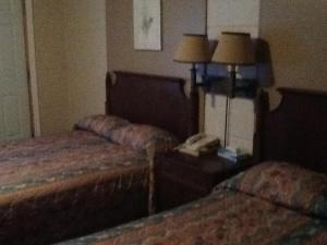 Postel nebo postele na pokoji v ubytování Motel Du Parc Masson