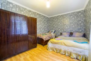 a bedroom with two beds in a room at Anastasia Guesthouse in Borjomi