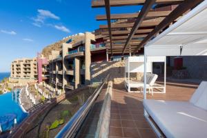 a balcony of a hotel with a view of the ocean at Gloria Palace Royal Hotel & Spa in Puerto Rico de Gran Canaria