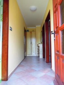 an empty hallway with a door and a tile floor at Apartment Antonia in Dobova