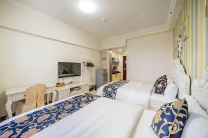 Kama o mga kama sa kuwarto sa Xing Yu Legend Service Apartment Canton Fair Branch