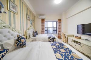 Kama o mga kama sa kuwarto sa Xing Yu Legend Service Apartment Canton Fair Branch