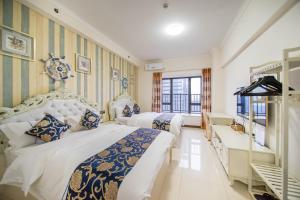 Kama o mga kama sa kuwarto sa Xing Yu Legend Service Apartment Canton Fair Branch