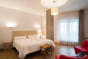 Postel nebo postele na pokoji v ubytování Hotel Montañés
