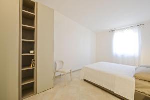 Un ou plusieurs lits dans un hébergement de l'établissement Blue Sea Villas by Wonderful Italy