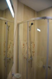 a bathroom with a shower and a sink at studio ASI in Obzor