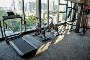 a gym with several cardio bikes in front of a window at Paco Hotel Guangzhou Zoo Metro Branch in Guangzhou