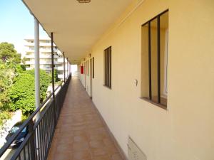 a walkway with a view of a building at Rex Apartment in Salou