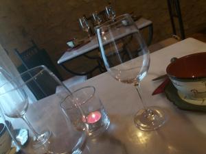 three wine glasses sitting on top of a table at Carpe Diem in Navaridas