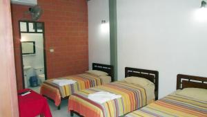 Postel nebo postele na pokoji v ubytování Hotel Ambaibo