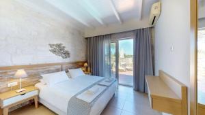 Posteľ alebo postele v izbe v ubytovaní Lofos Village Chania + 37 fotografií