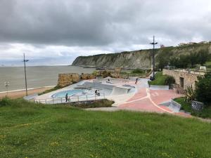a group of skate ramps next to the ocean at Pensión Basagoiti in Getxo