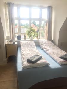 Säng eller sängar i ett rum på Køge Bed & Kitchen - Rooms