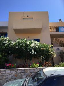 a car parked in front of a building at Eugenia travasarou sea view appartments in Diakofti