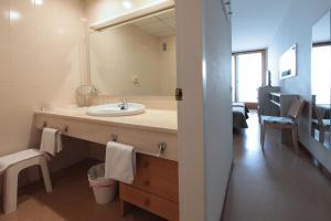 a bathroom with a sink and a mirror at Hotel Maria Teresa in Sant Antoni de Calonge +50 photos