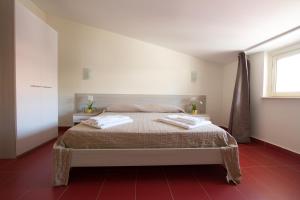 Кровать или кровати в номере B&B Baglio Santa Croce