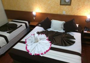 Postel nebo postele na pokoji v ubytování Hotel Rafeli
