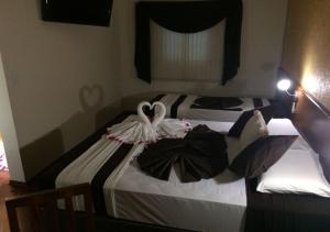 Postel nebo postele na pokoji v ubytování Hotel Rafeli