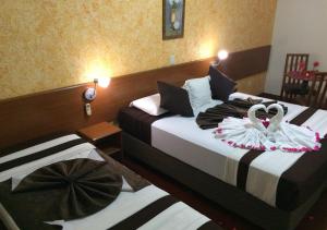Postel nebo postele na pokoji v ubytování Hotel Rafeli