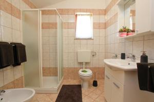 Kylpyhuone majoituspaikassa Apartment Vita