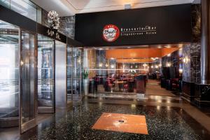 a restaurant with a counter in the middle of a building at Millennium Hotel Broadway Times Square in New York