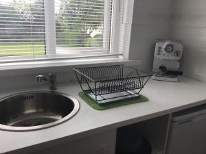 a kitchen counter with a sink and a window at Hillcrest House Self Catering Apartments in Donegal